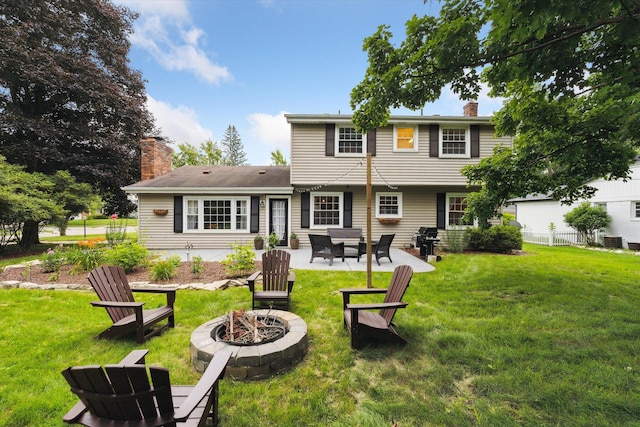 539 Old Bridge Rd, Grand Blanc, MI 48439 - rear view of house featuring an outdoor fire pit, a chimney, and a patio