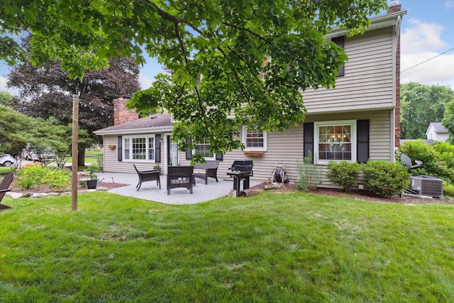 539 Old Bridge Rd, Grand Blanc, MI 48439 - rear view of property with a patio area, a yard, and a chimney