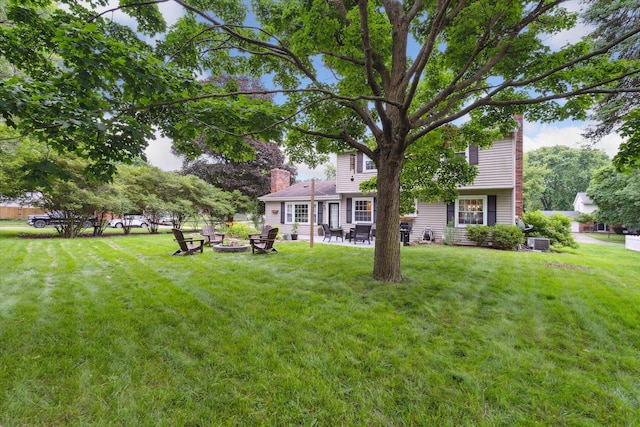539 Old Bridge Rd, Grand Blanc, MI 48439 - view of grassy yard featuring an outdoor fire pit