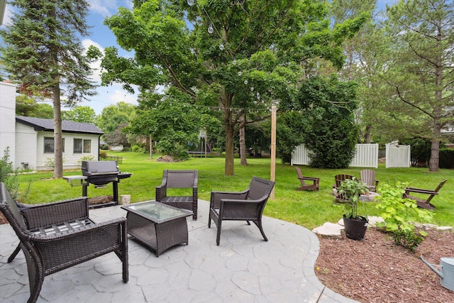 539 Old Bridge Rd, Grand Blanc, MI 48439 - view of patio featuring grilling area, outdoor lounge area, and view of wooded area