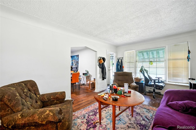18995 Fielding St, Detroit, MI 48219 - living room with a textured ceiling, wood finished floors, and an office area