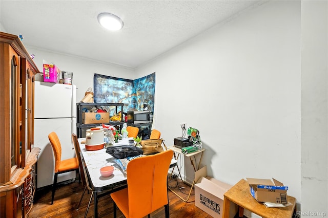 18995 Fielding St, Detroit, MI 48219 - dining area featuring wood finished floors, crown molding, and a textured ceiling