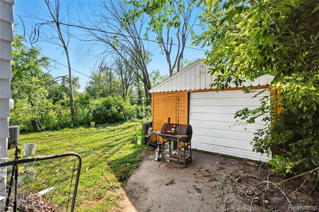 18995 Fielding St, Detroit, MI 48219 - view of grassy yard featuring an outbuilding and a detached garage
