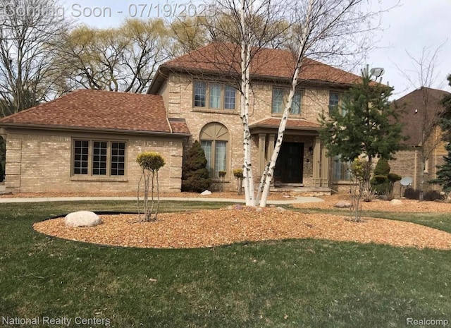 39376 Heatherbrook Dr, Farmington Hills, MI 48331 - view of front facade featuring brick siding and a front lawn