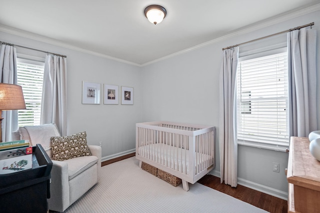 2213 N Wilson Ave, Royal Oak, MI 48073 - bedroom with wood finished floors, ornamental molding, and a crib