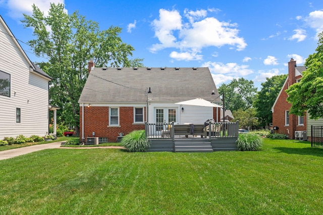 2213 N Wilson Ave, Royal Oak, MI 48073 - rear view of property with french doors, a yard, a wooden deck, brick siding, and a chimney