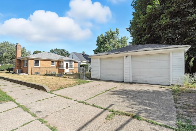 2707 Byron Center Ave SW, Wyoming, MI 49519 - view of front of home featuring an outdoor structure, a detached garage, a chimney, and brick siding