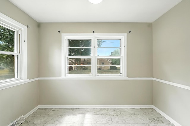 2707 Byron Center Ave SW, Wyoming, MI 49519 - unfurnished room featuring light marble finish floors and baseboards