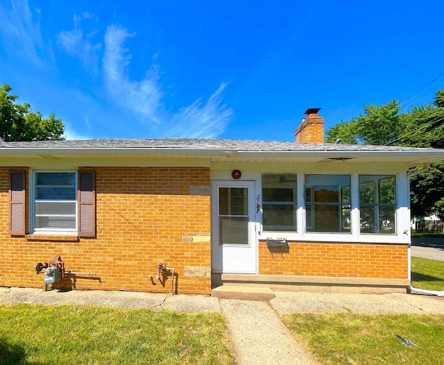 2707 Byron Center Ave SW, Wyoming, MI 49519 - view of front of home with brick siding and a chimney