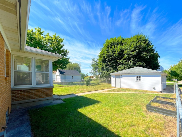 2707 Byron Center Ave SW, Wyoming, MI 49519 - view of yard with a vegetable garden and an outdoor structure