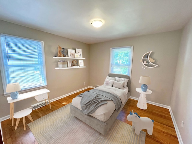 2707 Byron Center Ave SW, Wyoming, MI 49519 - bedroom with wood finished floors and baseboards