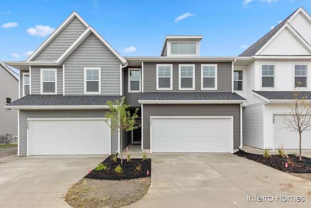 3351 Kings River St SW Unit 35, Wyoming, MI 49418 - view of front of home with an attached garage, driveway, and roof with shingles