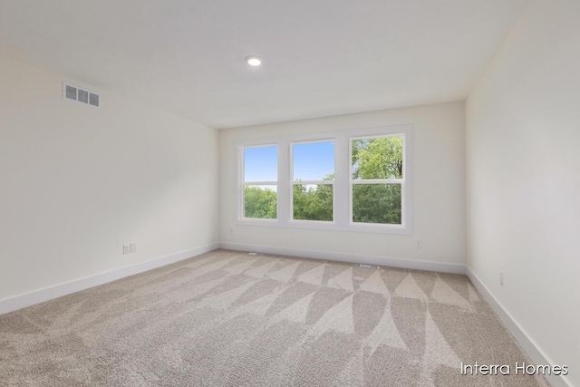 3351 Kings River St SW Unit 35, Wyoming, MI 49418 - empty room featuring light colored carpet and recessed lighting