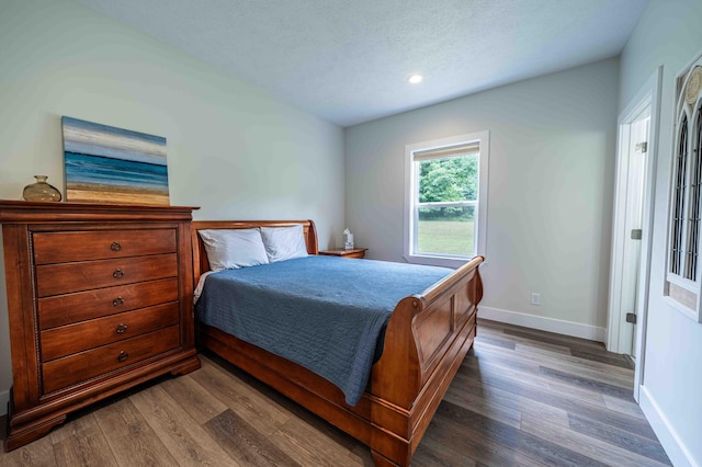 7898 W Juniper Beach Rd, Mears, MI 49436 - bedroom featuring wood finished floors, recessed lighting, and a textured ceiling
