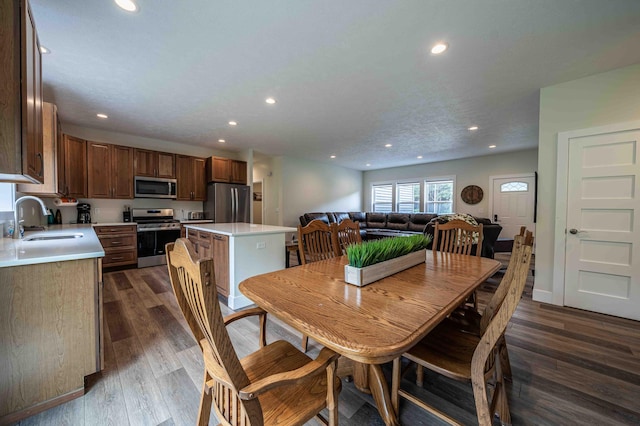 7898 W Juniper Beach Rd, Mears, MI 49436 - dining area with recessed lighting and dark wood-style floors