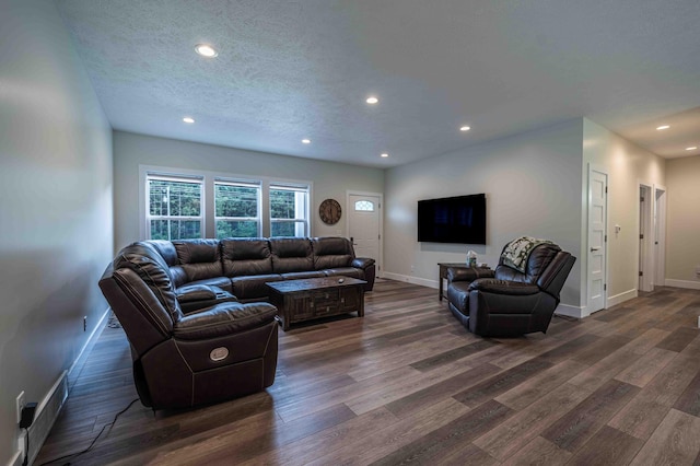 7898 W Juniper Beach Rd, Mears, MI 49436 - living room with dark wood-type flooring, recessed lighting, and a textured ceiling