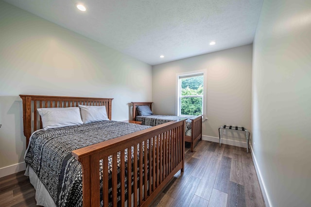 7898 W Juniper Beach Rd, Mears, MI 49436 - bedroom with wood finished floors, recessed lighting, and a textured ceiling