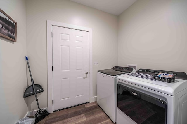 7898 W Juniper Beach Rd, Mears, MI 49436 - laundry room with independent washer and dryer and dark wood-style floors