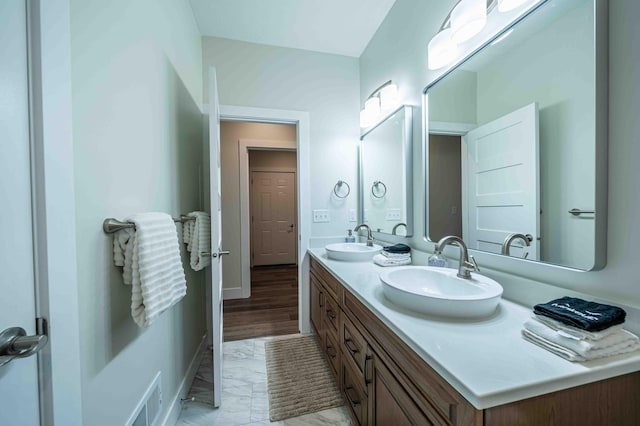 7898 W Juniper Beach Rd, Mears, MI 49436 - full bathroom featuring double vanity and marble finish flooring