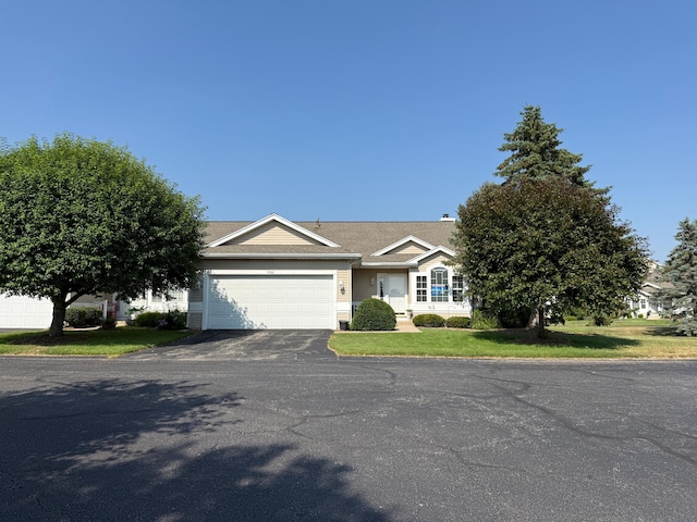 5766 Wineberry Ln SW, Wyoming, MI 49418 - single story home featuring driveway, a garage, and a front yard
