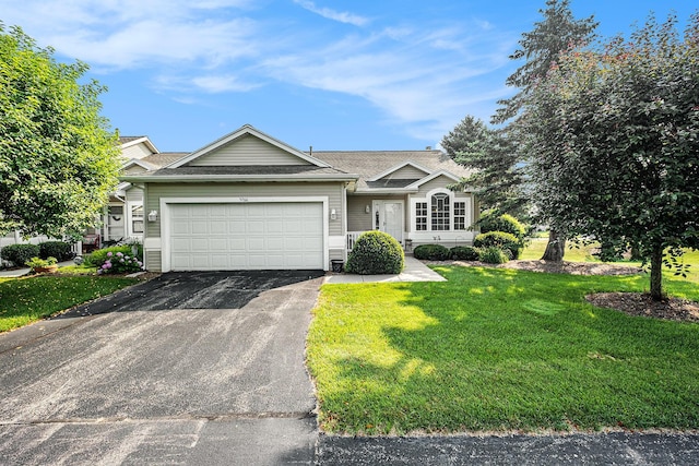 5766 Wineberry Ln SW, Wyoming, MI 49418 - ranch-style home with driveway, an attached garage, a front yard, and roof with shingles