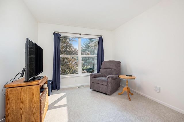 5766 Wineberry Ln SW, Wyoming, MI 49418 - living area featuring baseboards and carpet