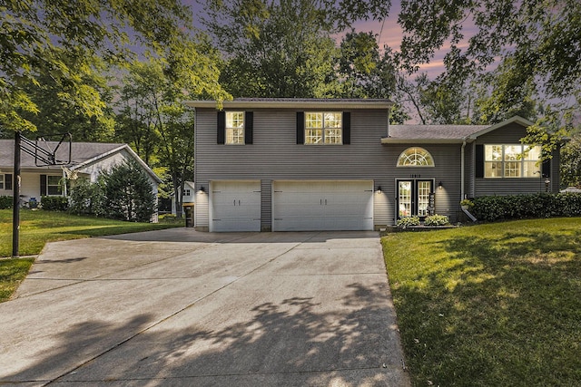 12912 Valley Dr, Wayland, MI 49348 - view of front of house with a garage, driveway, and a yard