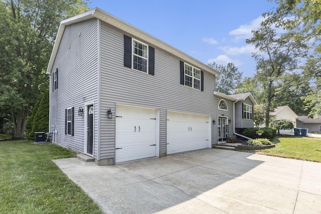 12912 Valley Dr, Wayland, MI 49348 - view of front of home featuring a garage, concrete driveway, and a front lawn