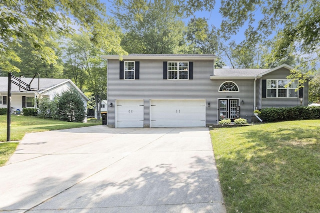 12912 Valley Dr, Wayland, MI 49348 - view of front facade featuring an attached garage, concrete driveway, and a front yard