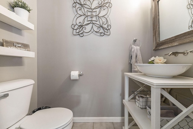 12912 Valley Dr, Wayland, MI 49348 - half bathroom featuring toilet and tile patterned flooring