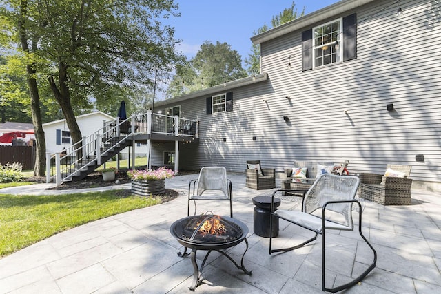 12912 Valley Dr, Wayland, MI 49348 - view of patio with a fire pit, stairway, and a deck