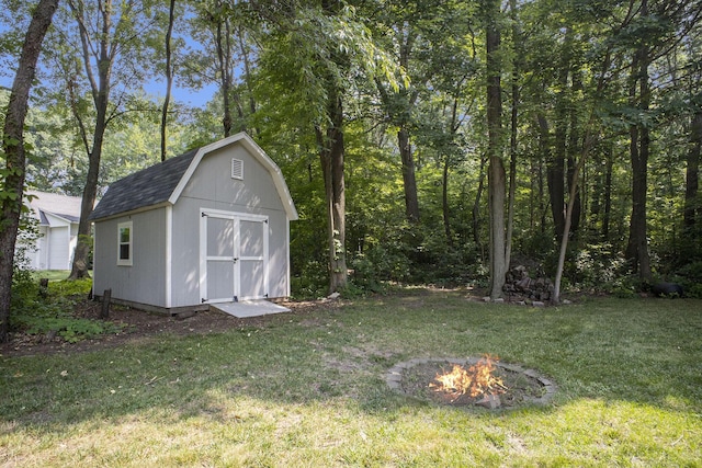 12912 Valley Dr, Wayland, MI 49348 - view of shed featuring an outdoor fire pit