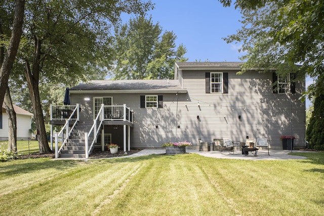 12912 Valley Dr, Wayland, MI 49348 - rear view of house featuring a patio, a wooden deck, a yard, and stairway