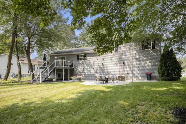 12912 Valley Dr, Wayland, MI 49348 - rear view of house with stairway, a deck, a yard, and a patio