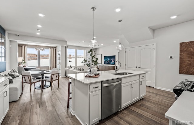 4066 Nottingham Cir, Clarkston, MI 48346 - kitchen with open floor plan, stainless steel appliances, light countertops, recessed lighting, and dark wood-type flooring