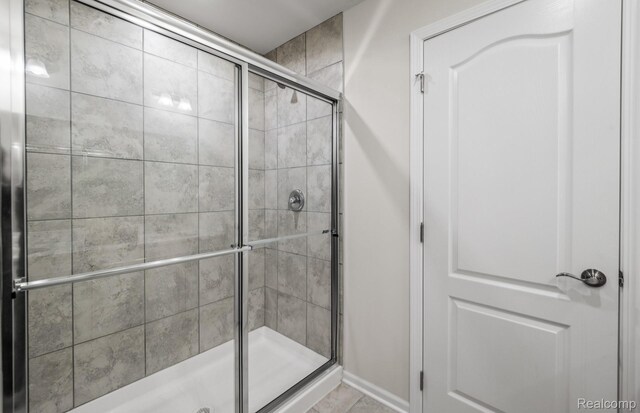 4066 Nottingham Cir, Clarkston, MI 48346 - full bath with a stall shower and baseboards