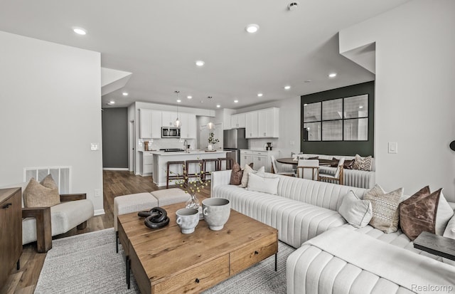 4066 Nottingham Cir, Clarkston, MI 48346 - living area with recessed lighting and wood finished floors