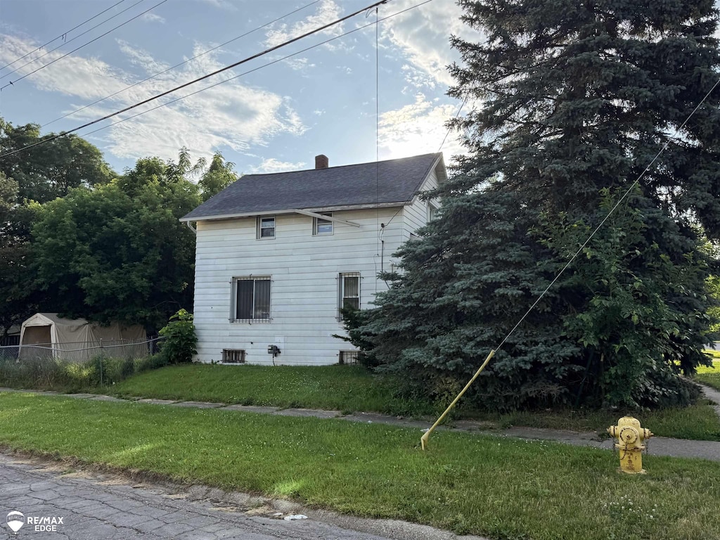 3926 W Court St, Flint, MI 48532 - view of property exterior featuring a chimney