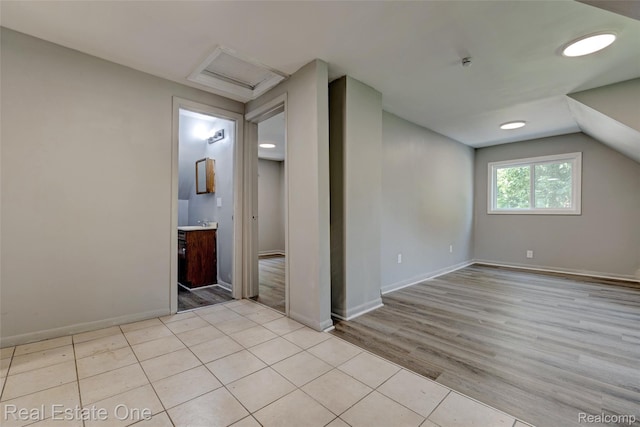 1425 Lincoln Ave, Flint, MI 48507 - spare room with attic access, wood finished floors, and vaulted ceiling