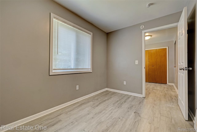 1425 Lincoln Ave, Flint, MI 48507 - unfurnished room with light wood-style floors and baseboards