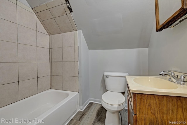 1425 Lincoln Ave, Flint, MI 48507 - bathroom featuring vaulted ceiling, wood finished floors, vanity, and shower / bathtub combination
