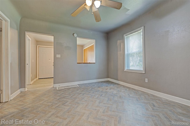 1425 Lincoln Ave, Flint, MI 48507 - empty room with a ceiling fan and baseboards