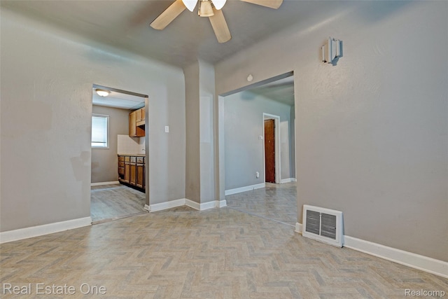 1425 Lincoln Ave, Flint, MI 48507 - empty room with ceiling fan and baseboards
