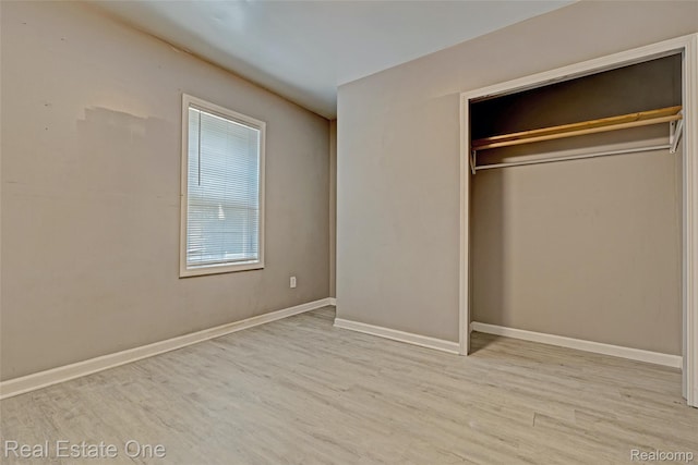 1425 Lincoln Ave, Flint, MI 48507 - unfurnished bedroom with wood finished floors and a closet