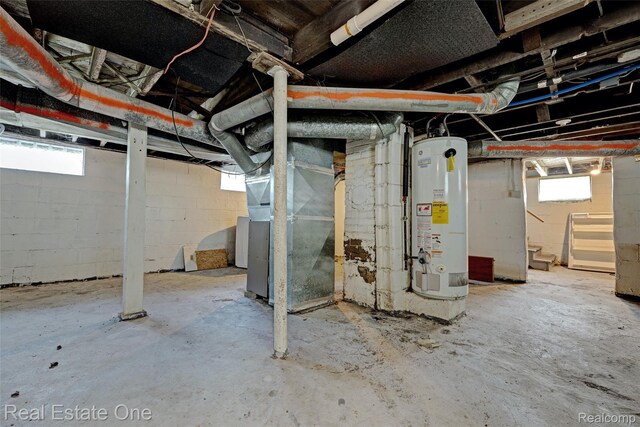 1425 Lincoln Ave, Flint, MI 48507 - below grade area with gas water heater, stairs, and heating unit