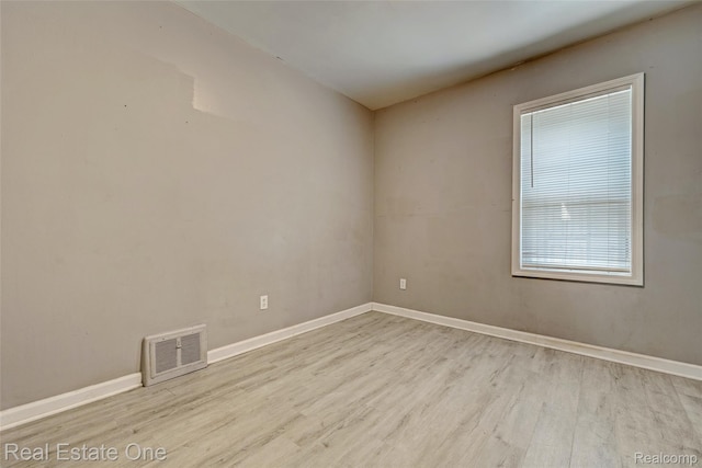 1425 Lincoln Ave, Flint, MI 48507 - empty room with wood finished floors and baseboards