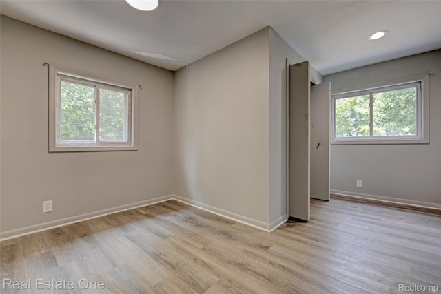 1425 Lincoln Ave, Flint, MI 48507 - unfurnished room with light wood-style flooring and recessed lighting