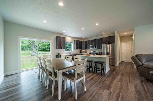 7920 W Juniper Beach Rd, Mears, MI 49436 - dining room with recessed lighting and dark wood-style floors