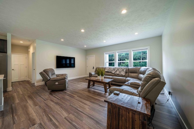 7920 W Juniper Beach Rd, Mears, MI 49436 - living room with dark wood-style flooring, recessed lighting, and a textured ceiling