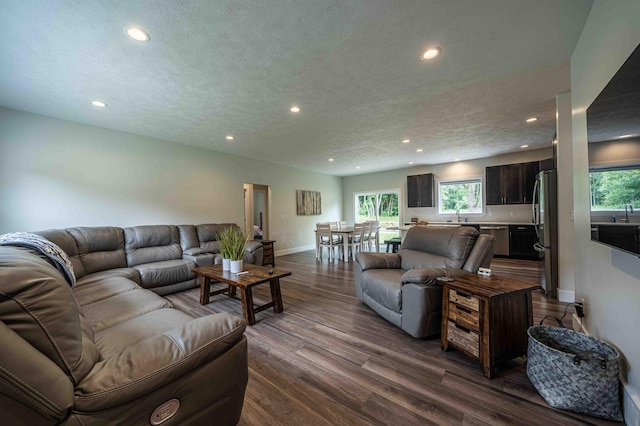 7920 W Juniper Beach Rd, Mears, MI 49436 - living room with recessed lighting, dark wood-type flooring, and a textured ceiling